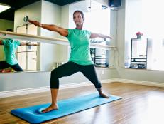 Black woman practicing yoga in studio