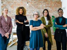 Portrait of successful female business team in office. Multiracial business group standing together and looking at camera.