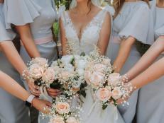 Photo of the bride and bridesmaids with wedding bouquets. Wedding day. Happy girls at their best friend's wedding. Summer wedding