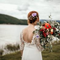 Boho Styled Bride Wearing Charming Fresh Bouquet Of Seasonal Flowers Taking a Walk by Lake