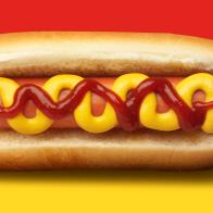 A hot dog garnished with mustard and ketchup on a red and yellow background.
