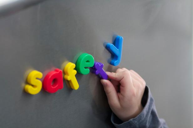 Magnetic letters spelling safety on stainless steel,