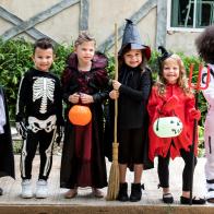 Diverse kids in Halloween costumes