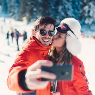 Couple having fun on winter holiday