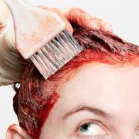 Permanent hair dye being applied with a watchful eye.