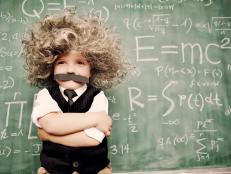 A young math whiz smiles as he has solved the riddles of the universe.