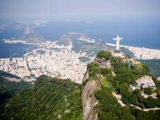 Aerial view of Rio de Janeiro on a sunny day taken from a helicopter.  In view are the landmarks Christ the Redeemer and Sugarloaf Mountain.