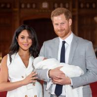 WINDSOR, ENGLAND - MAY 08: Prince Harry, Duke of Sussex and Meghan, Duchess of Sussex, pose with their newborn son Prince Archie Harrison Mountbatten-Windsor during a photocall in St George's Hall at Windsor Castle on May 8, 2019 in Windsor, England. The Duchess of Sussex gave birth at 05:26 on Monday 06 May, 2019. (Photo by Dominic Lipinski - WPA Pool/Getty Images)