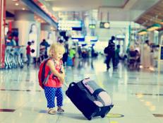 little girl with suitcase travel in the airport, kids travel
