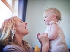Shot of an adorable baby girl bonding with her mother at home