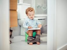Child sitting on the toilet