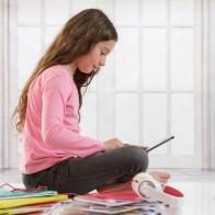 Girl doing homework. (Photo by:  BSIP/Universal Images Group via Getty Images)