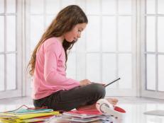 Girl doing homework. (Photo by:  BSIP/Universal Images Group via Getty Images)