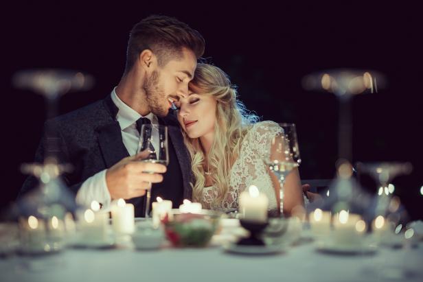Just married beautiful couple has a romantic dinner