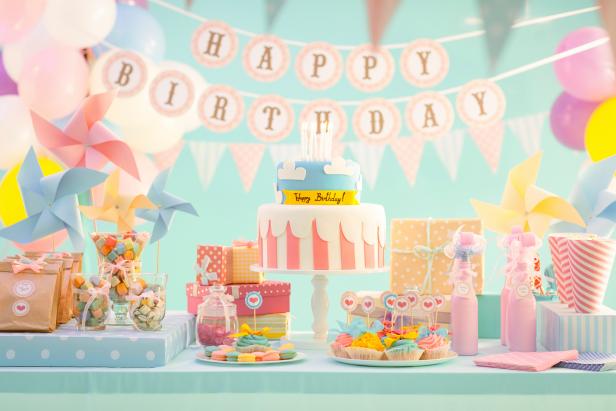 "Cake, candy and gifts at birthday party"
