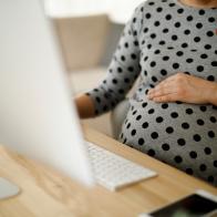 Pregnant woman working from home office