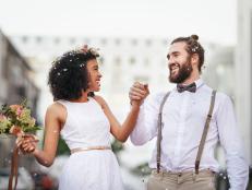 Shot of a newly married young couple celebrating their wedding day against an urban background