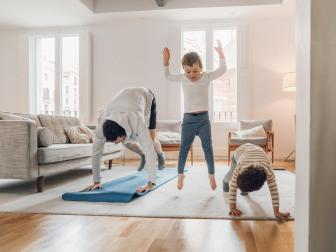 Father with children exercising at home