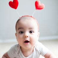7 month old baby models hearts on his head