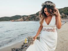 Photo of  bride walking on the beach