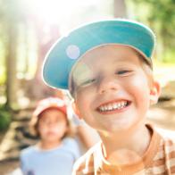 Little Boy Smiling at the camera in Campground