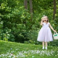 Girl proudly shows off Easter egg.