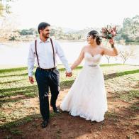 Wedding bride and groom celebrating with joy in nature