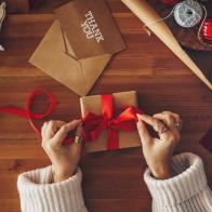 Woman wrapping Christmas gifts