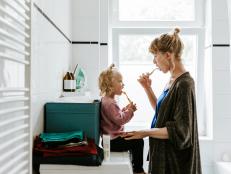 Photo series of a young mother with a child doing different chores at home. Shot in Berlin.