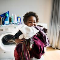 Young boy doing housework at home