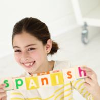 Bilingual child holding wooden blocks