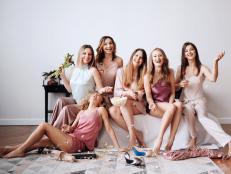 Young girls, bridesmaids spend time together, drink champagne. Hen party before the wedding.