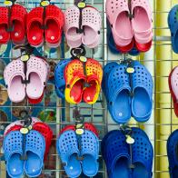 UNITED KINGDOM - JUNE 10:  Beach shoes on sale at general store selling seaside products in Aberdyfi, Aberdovey, Snowdonia, Wales  (Photo by Tim Graham/Getty Images)