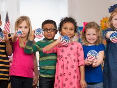Students with vote buttons in kindergarten class