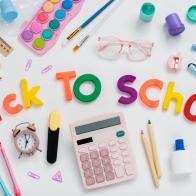 Back to school concept. Creative composition of school stationery  on a white background. Top view, flat lay.