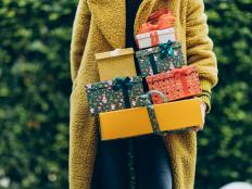 Woman holding stack of Christmas gift. New Year or Christmas concept.