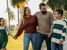 Family talking while walking through the public park