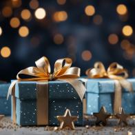 Holiday presents wrapped in teal paper and gold glitter, with a bokeh light backdrop