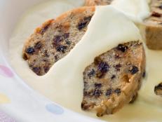 Bowl of Spotted Dick with Custard on Table