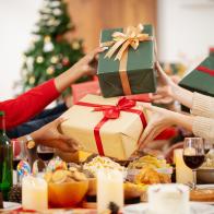 The family is happily exchanging gifts at Christmas.