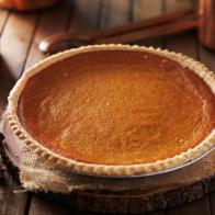 pumpkin pie in rustic setting shot with selective focus