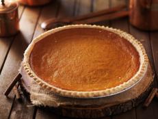 pumpkin pie in rustic setting shot with selective focus